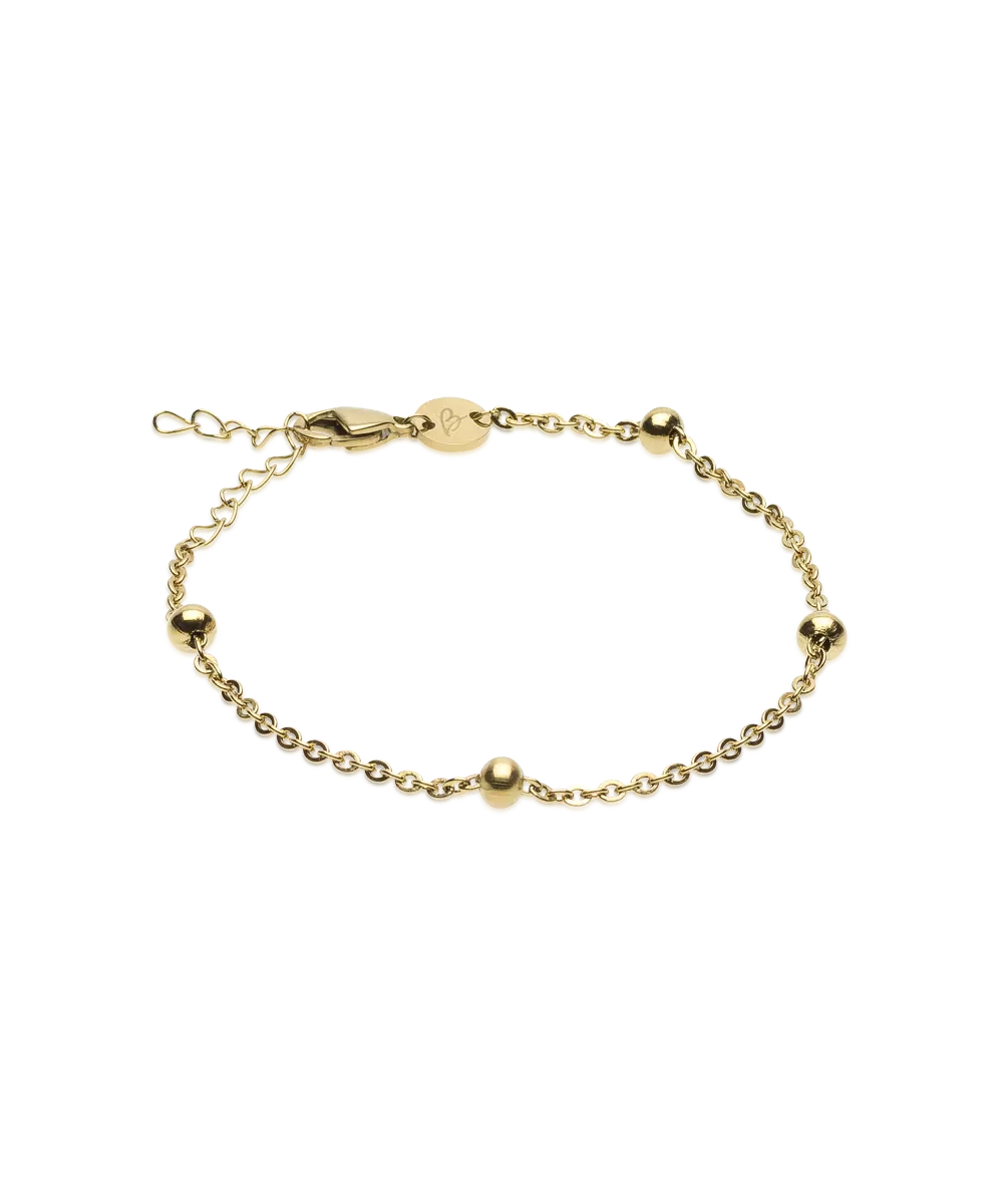 Gullhúðað armband með kúlum.
