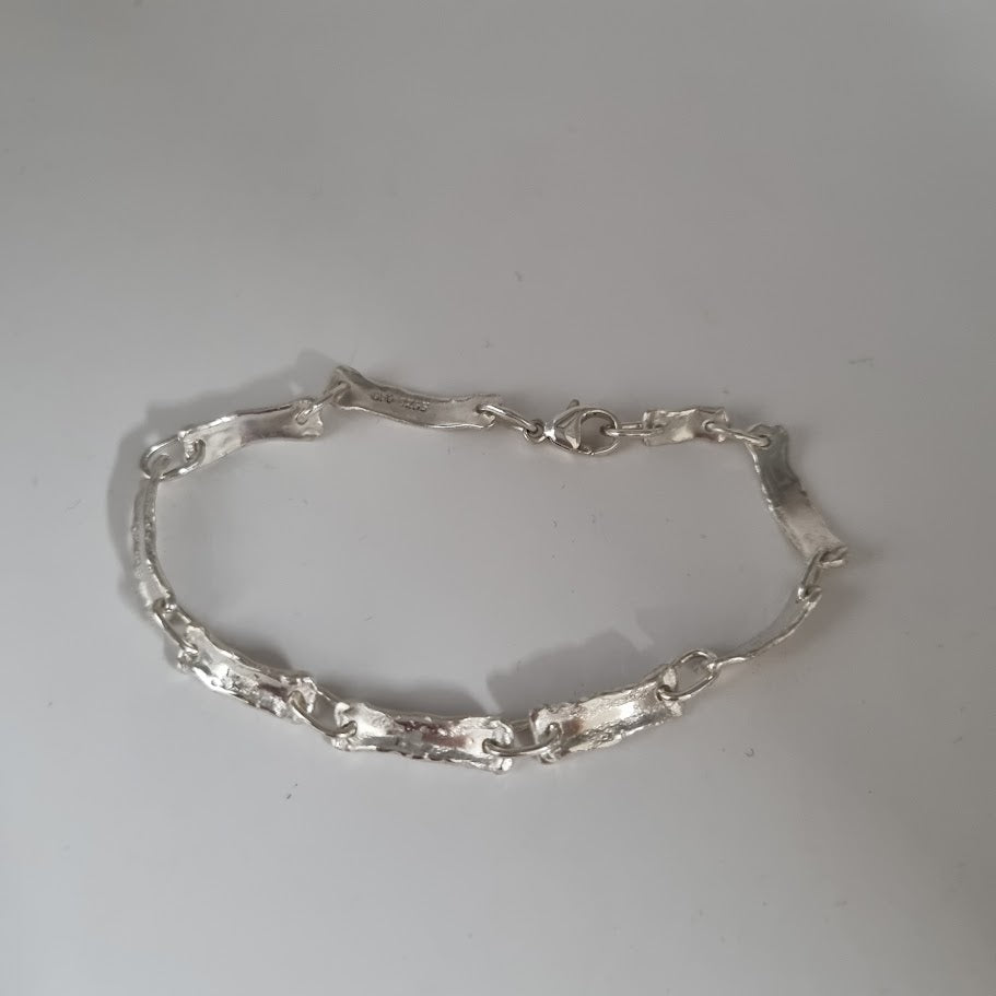 Sérsmíðað silfur armband